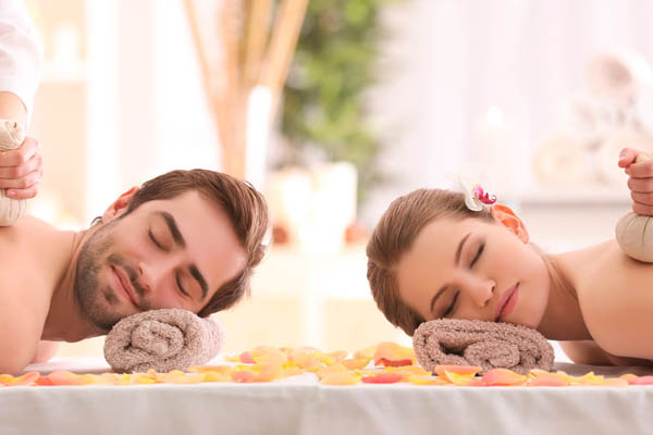 Couple enjoying spa massage
